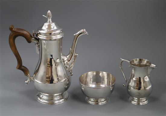 A modern silver three piece coffee set by Rodney C. Pettit, London, 1985, gross 51 oz.